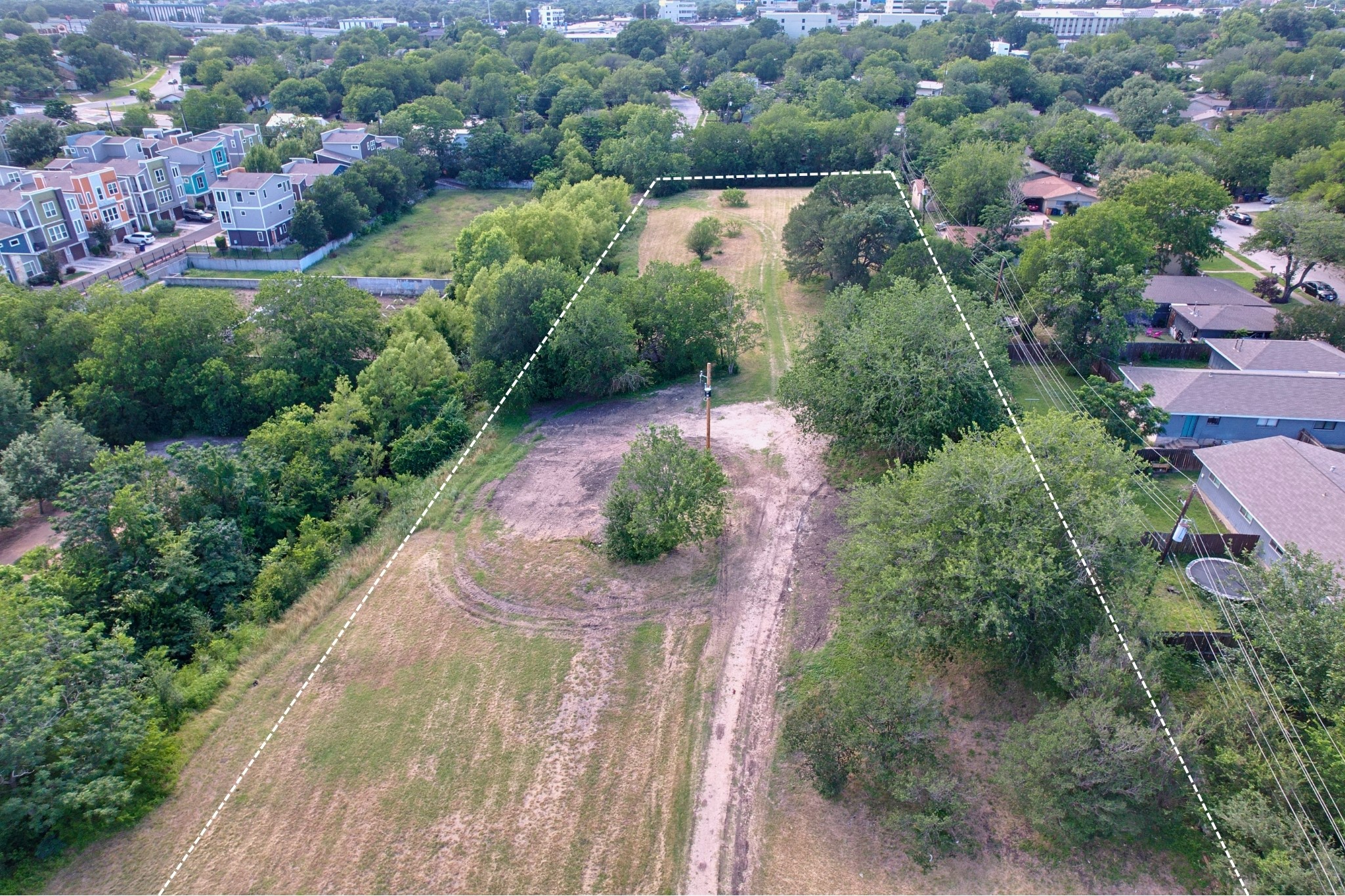 2610-2606 Metcalfe Road Austin, TX 78741 - Photo 12 of 20 A spacious, buildable lot awaits development in a verdant setting near urban conveniences.
