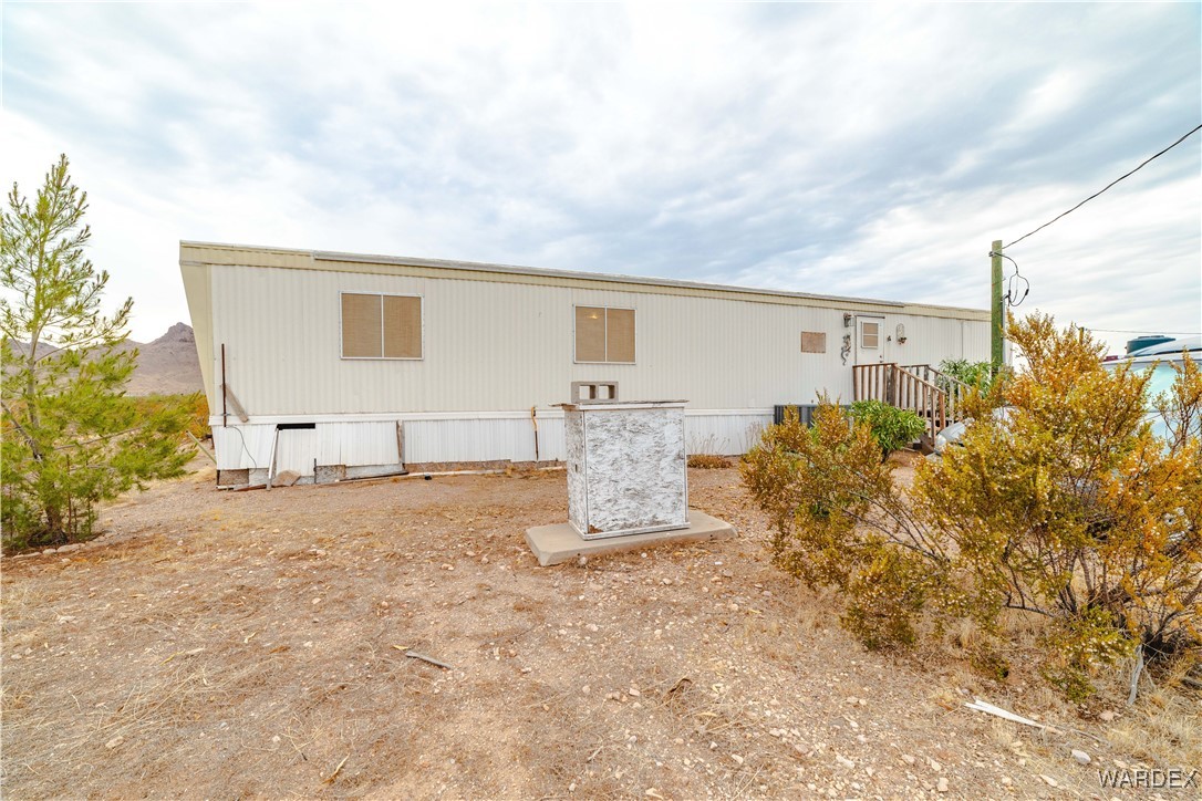 2565 Hopi Road Golden Valley, AZ 86413 - Photo 25 of 40 a view of a house with backyard and garden