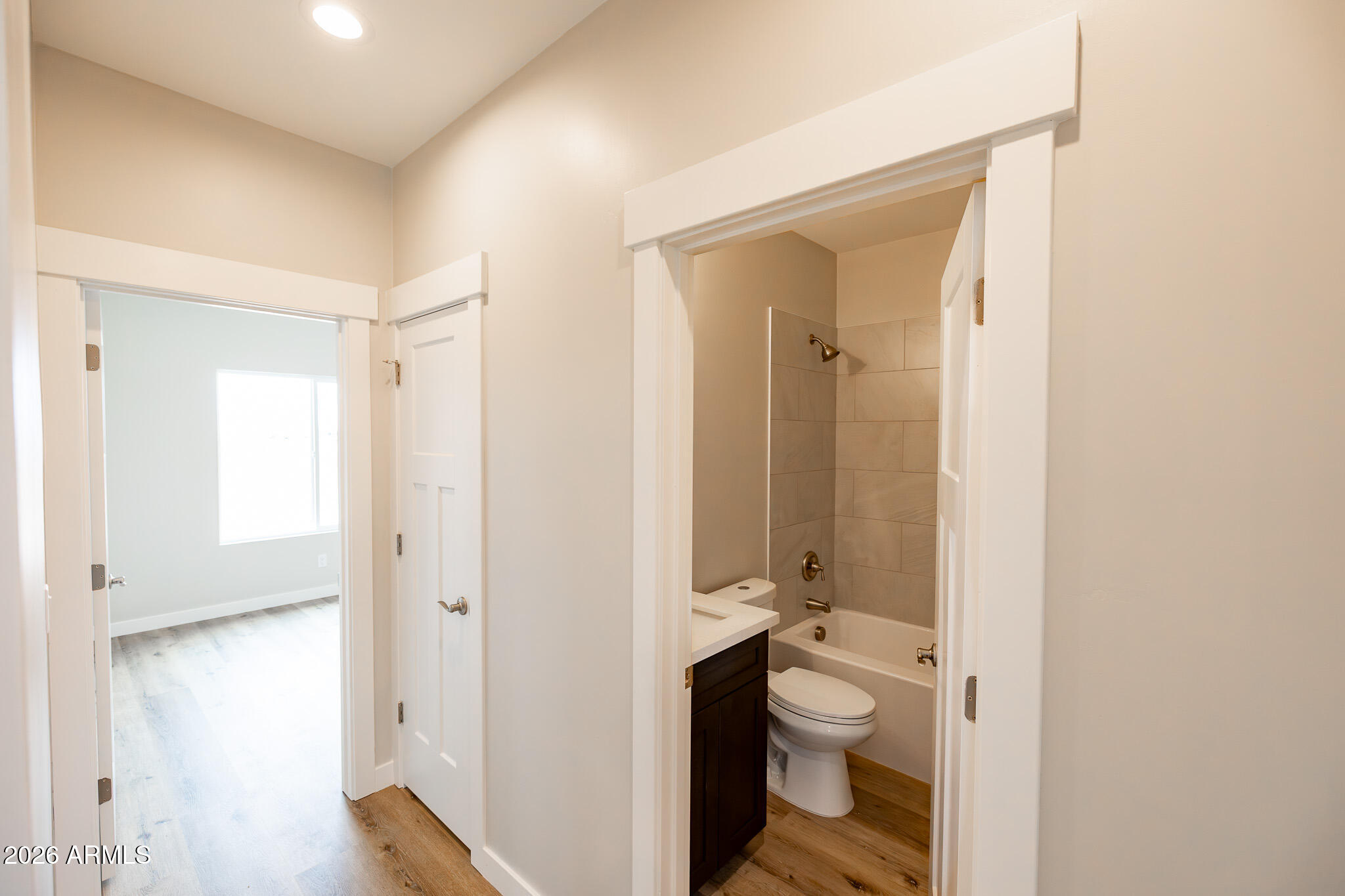 11459 East Adamsville Road Florence, AZ 85132 - Photo 18 of 63 a bathroom with a granite countertop toilet a sink and a mirror