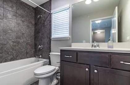 a bathroom with a sink a toilet and a bathtub