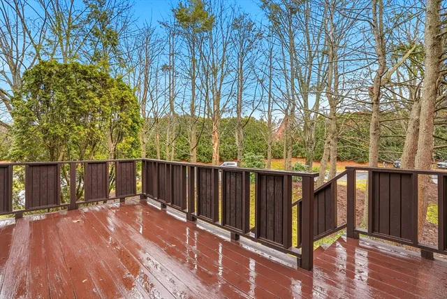 a view of deck with wooden floor and fence