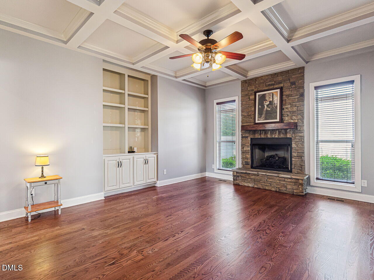 136 Kenneth Lane Willow Spring, NC 27592 - Photo 28 of 94 Family room with raised hearth, stone fireplace, mantle and gas logs plus built in bookshelves