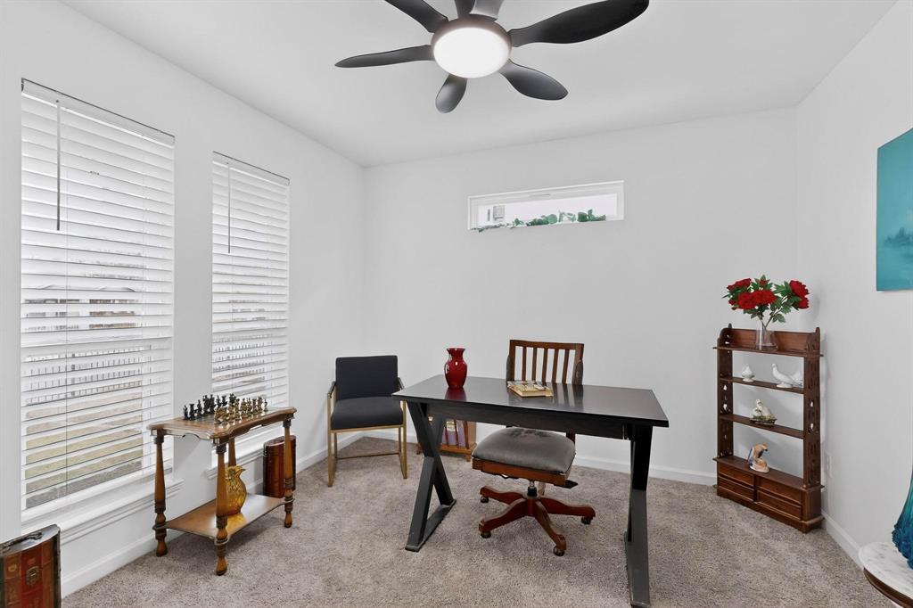 1202 Morrell Avenue Dallas, TX 75203 - Photo 11 of 33 a view of a workspace with furniture and a window