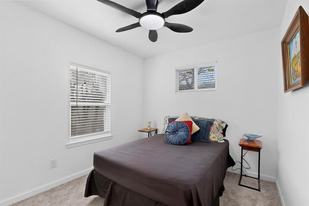 1202 Morrell Avenue Dallas, TX 75203 - Photo 13 of 33 a bedroom with a bed and a window