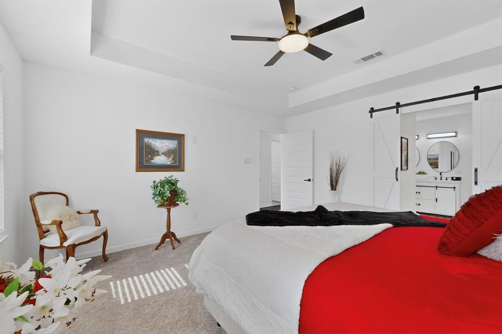 1202 Morrell Avenue Dallas, TX 75203 - Photo 14 of 33 a bedroom with a bed and chair