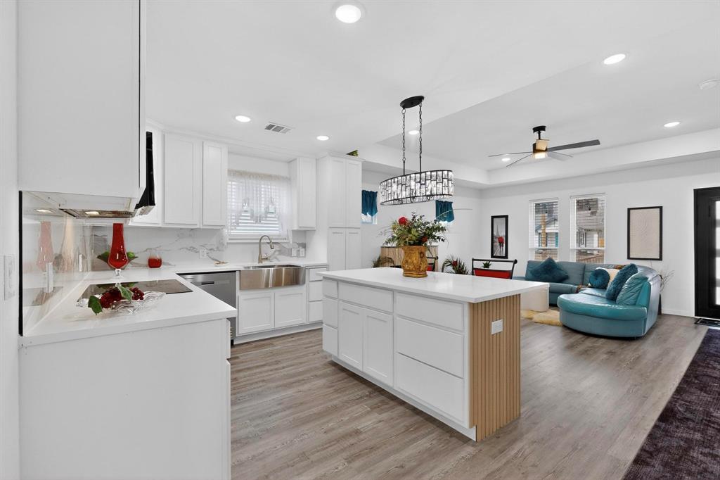 1202 Morrell Avenue Dallas, TX 75203 - Photo 19 of 33 a kitchen filled with white cabinets and white appliances