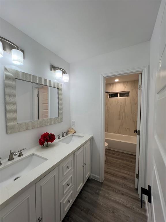 1202 Morrell Avenue Dallas, TX 75203 - Photo 20 of 33 a bathroom with a double vanity sink mirror and double