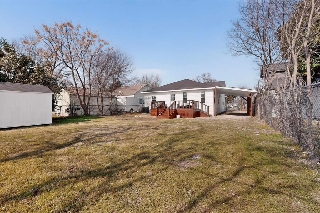 1202 Morrell Avenue Dallas, TX 75203 - Photo 25 of 33 a view of a house with a large tree in front of it
