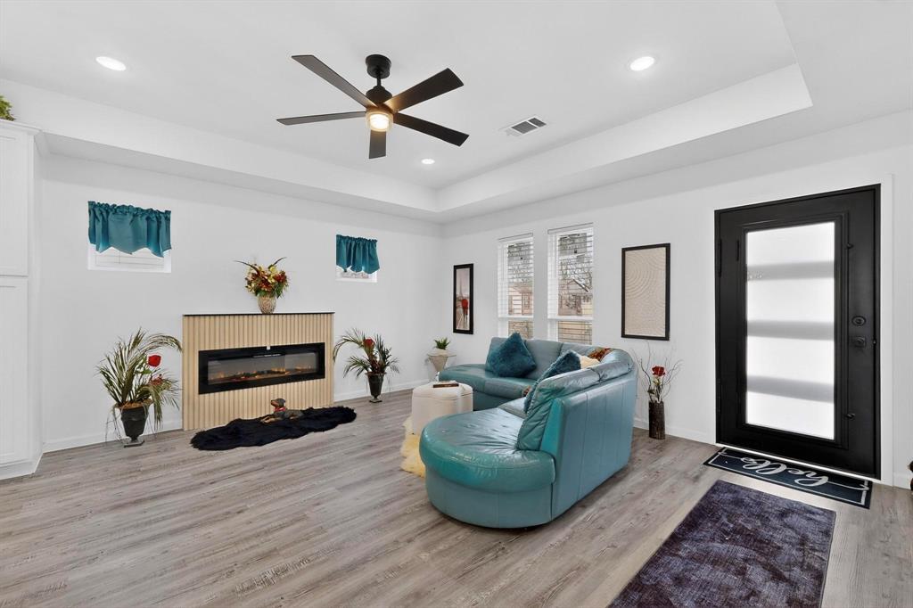 1202 Morrell Avenue Dallas, TX 75203 - Photo 5 of 33 a living room with furniture and a window