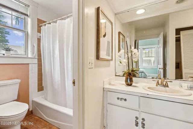 a bathroom with a toilet a sink and a bathtub