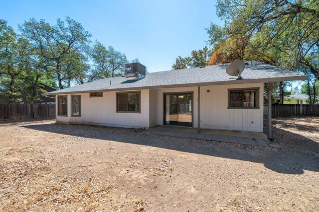 a view of a house with a yard covered with snow