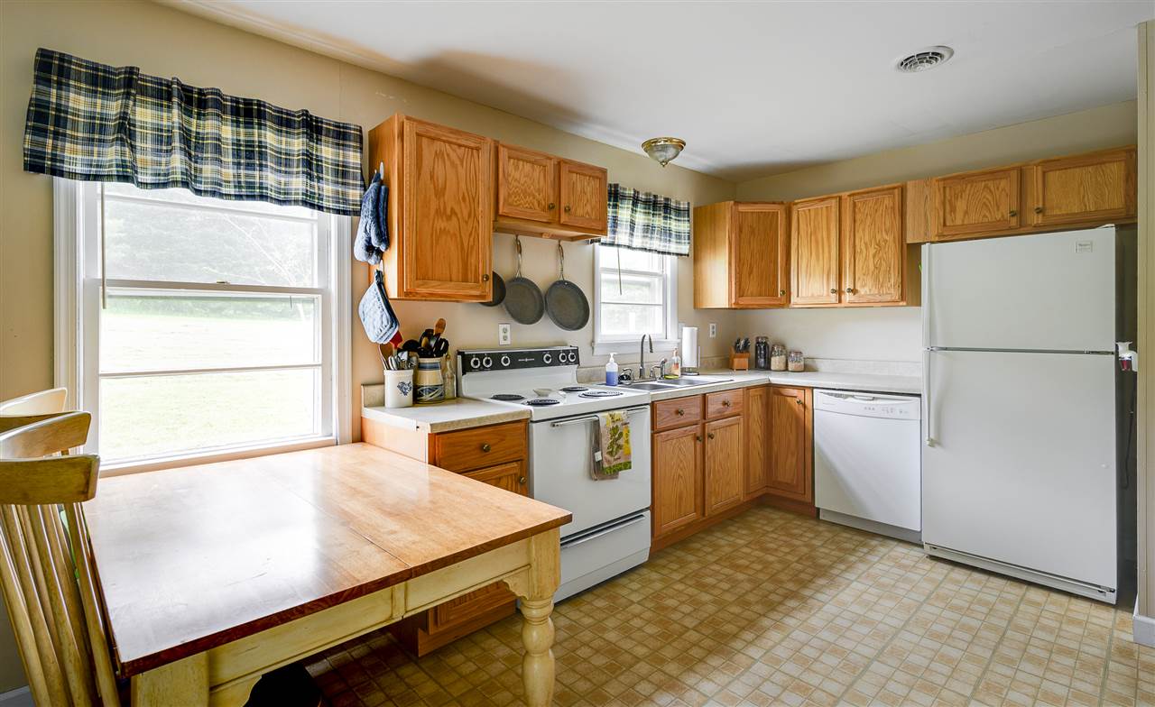 860 Fort Valley Road Fort Valley, VA 22652 - Photo 21 of 31 a kitchen with a refrigerator sink and cabinets