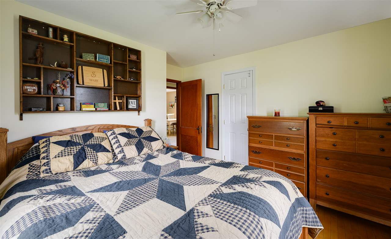 860 Fort Valley Road Fort Valley, VA 22652 - Photo 26 of 31 a bedroom with a bed and a dresser