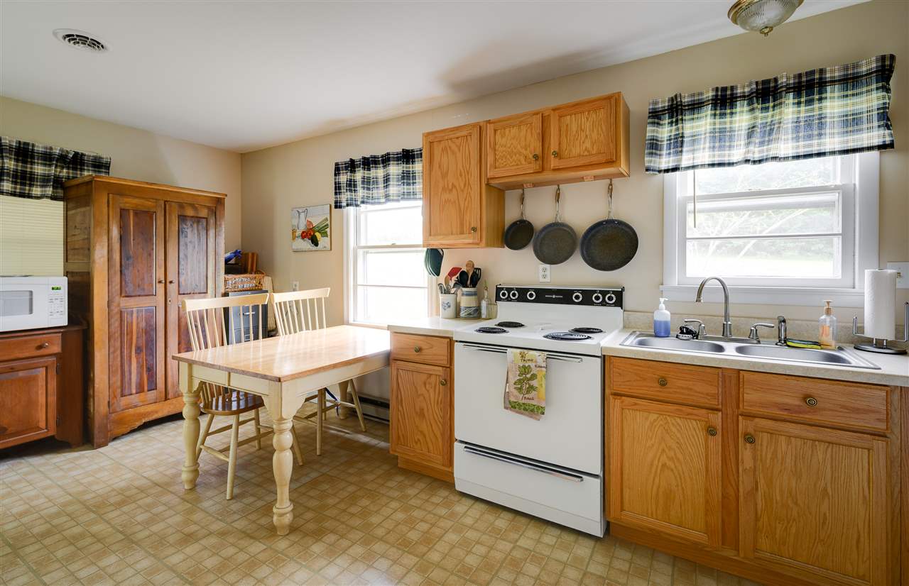 860 Fort Valley Road Fort Valley, VA 22652 - Photo 29 of 31 a kitchen with a sink cabinets and window