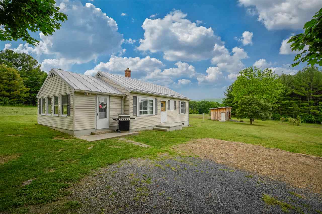 860 Fort Valley Road Fort Valley, VA 22652 - Photo 9 of 31 a view of a house with a yard and a porch