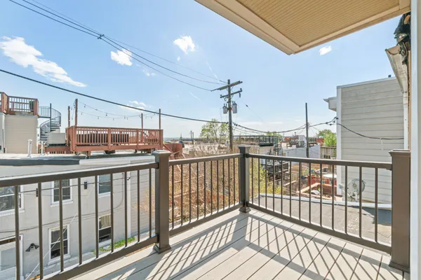 a view of a balcony with wooden floor