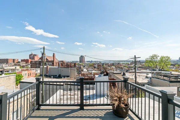 a view of a balcony with city view