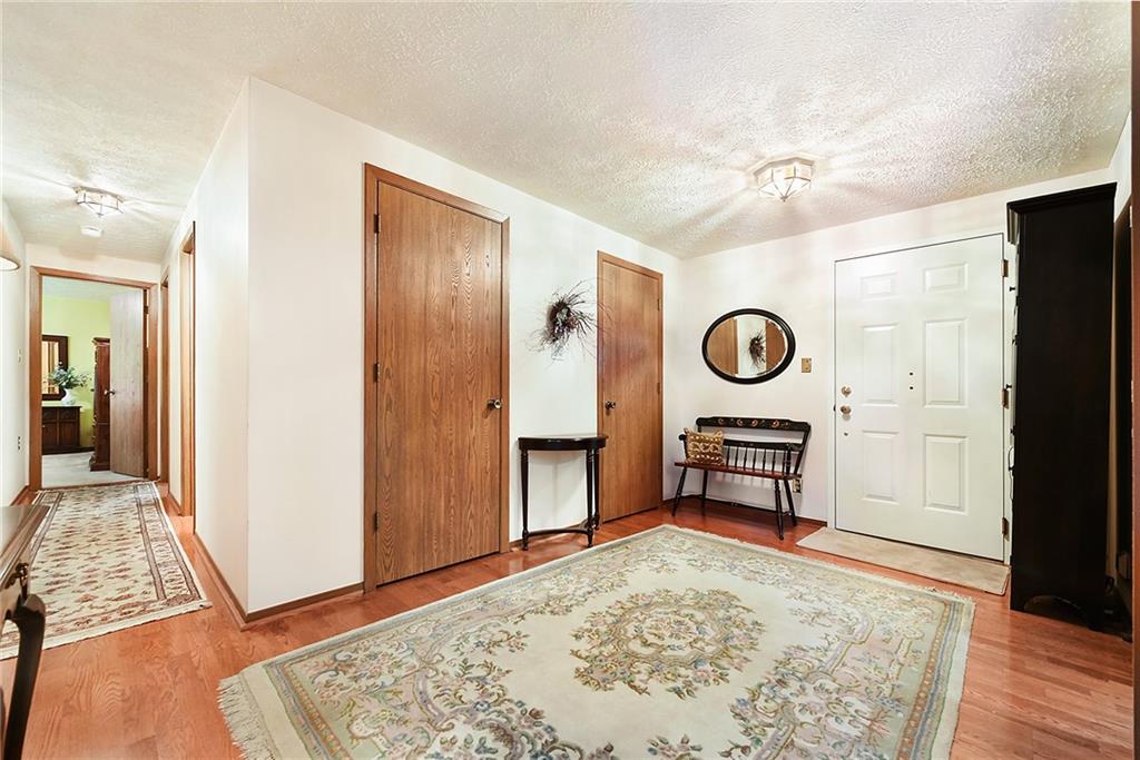 2850 Edgecliff Road, Unit 14 Lower Burrell, PA 15068 - Photo 11 of 24 a view of a livingroom with furniture and window