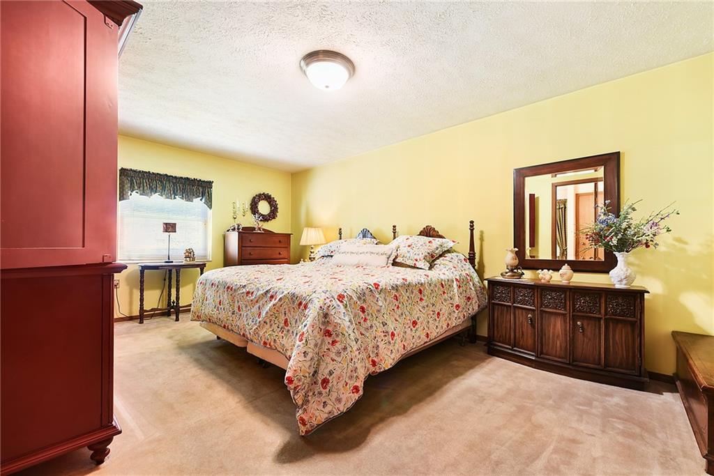 2850 Edgecliff Road, Unit 14 Lower Burrell, PA 15068 - Photo 14 of 24 a bedroom with bed and window