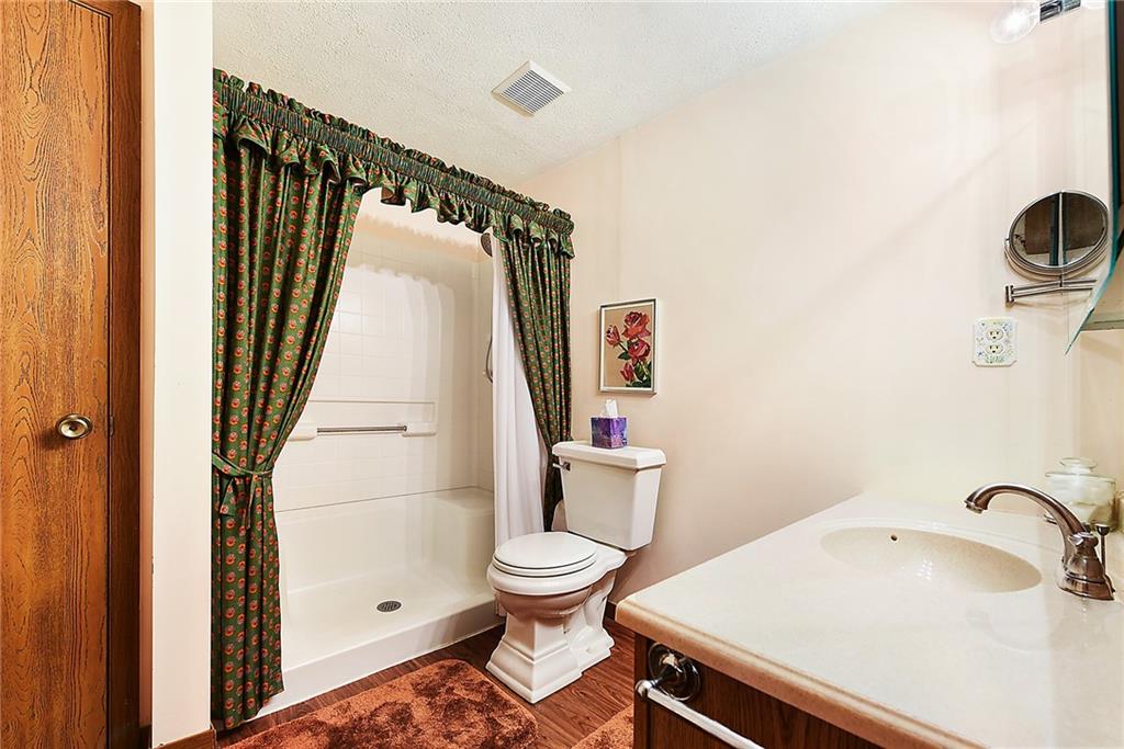 2850 Edgecliff Road, Unit 14 Lower Burrell, PA 15068 - Photo 15 of 24 a bathroom with a sink and a toilet