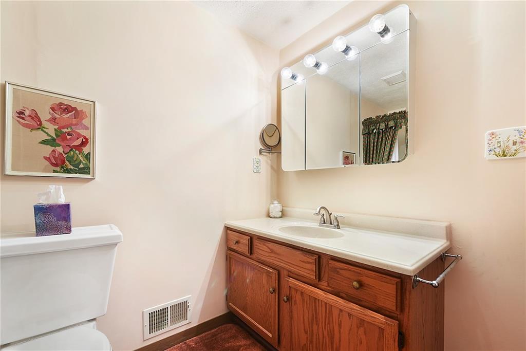 2850 Edgecliff Road, Unit 14 Lower Burrell, PA 15068 - Photo 16 of 24 a bathroom with a sink and a mirror