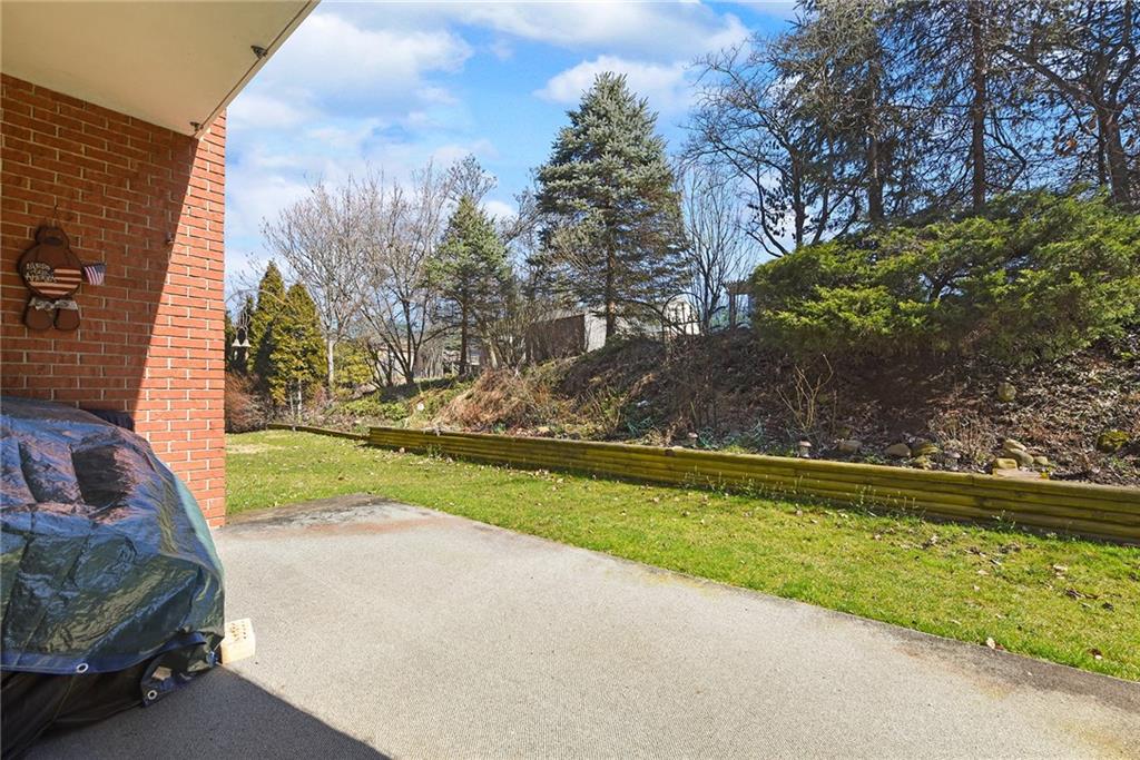 2850 Edgecliff Road, Unit 14 Lower Burrell, PA 15068 - Photo 23 of 24 a view of a yard and a fountain