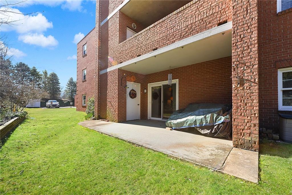 2850 Edgecliff Road, Unit 14 Lower Burrell, PA 15068 - Photo 24 of 24 a view of a house with a yard and pathway