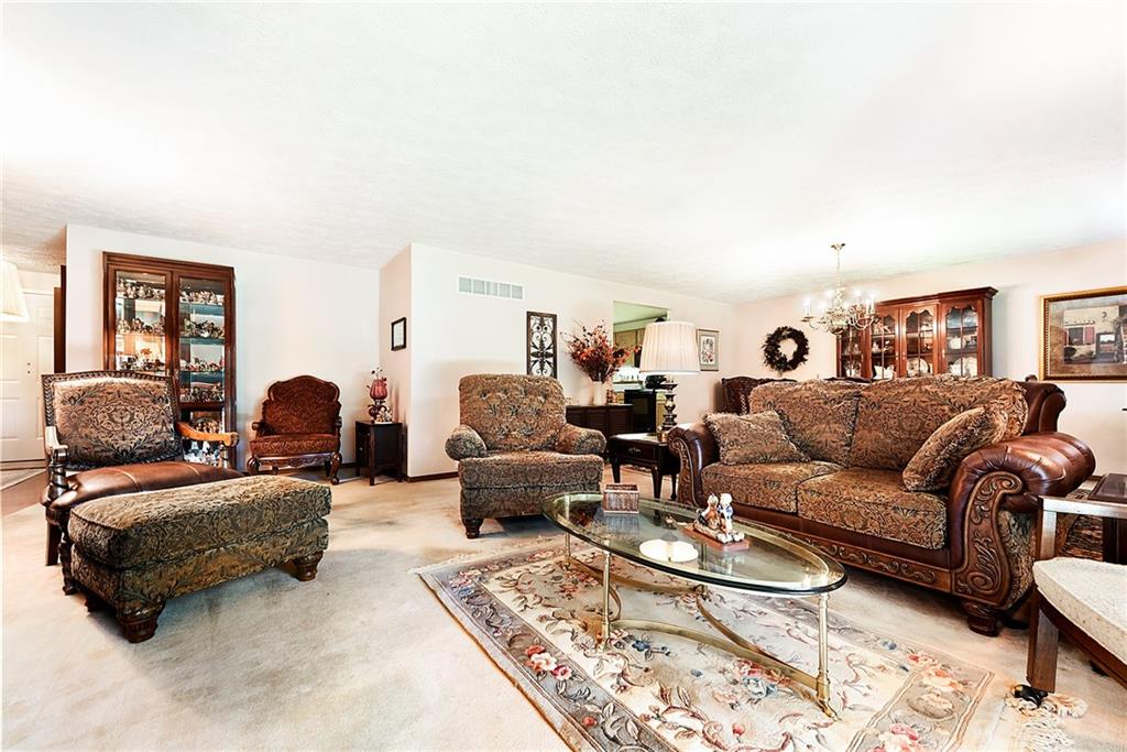 2850 Edgecliff Road, Unit 14 Lower Burrell, PA 15068 - Photo 5 of 24 a living room with furniture and a couch