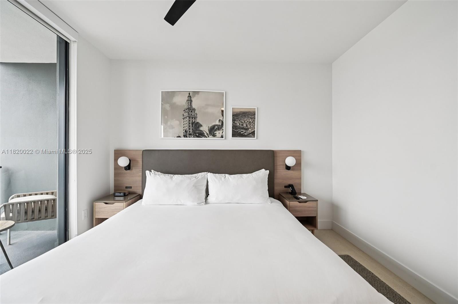 159 Northeast 6th Street, Unit 3407 Miami, FL 33132 - Photo 13 of 16 a bedroom with a bed and painting on the wall