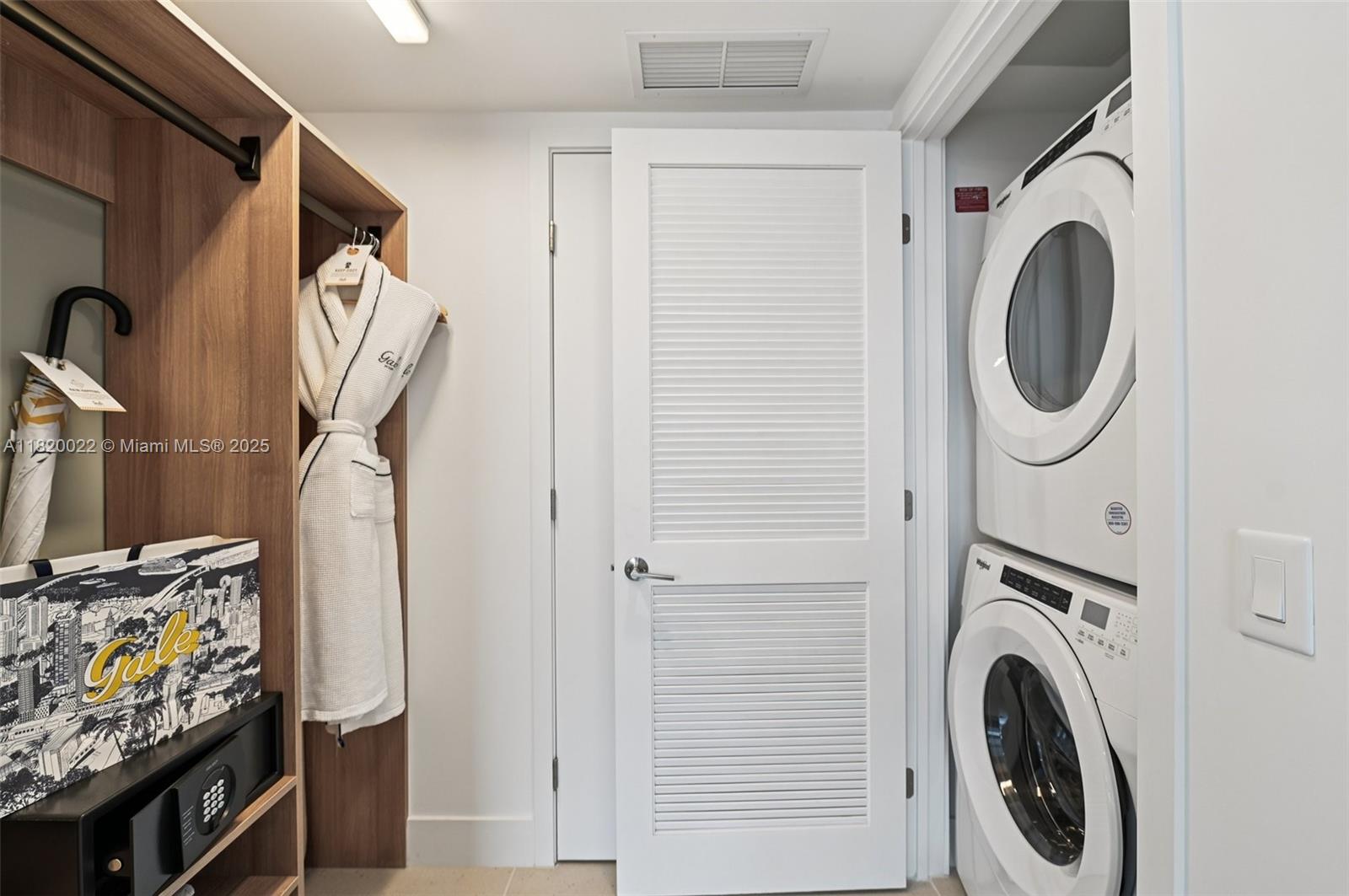 159 Northeast 6th Street, Unit 3407 Miami, FL 33132 - Photo 15 of 16 a utility room with dryer and washer