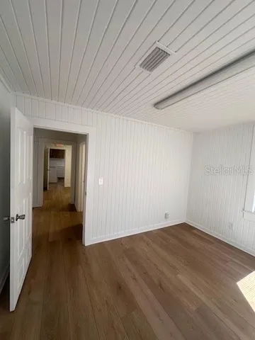 a view of a livingroom with wooden floor