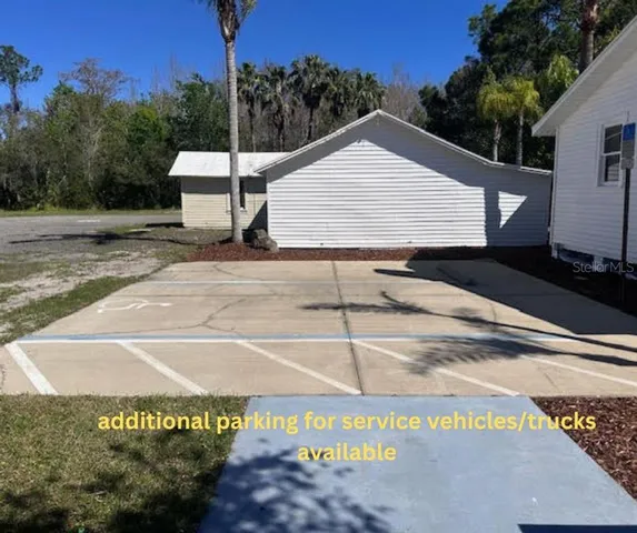a view of a street with a building in the background