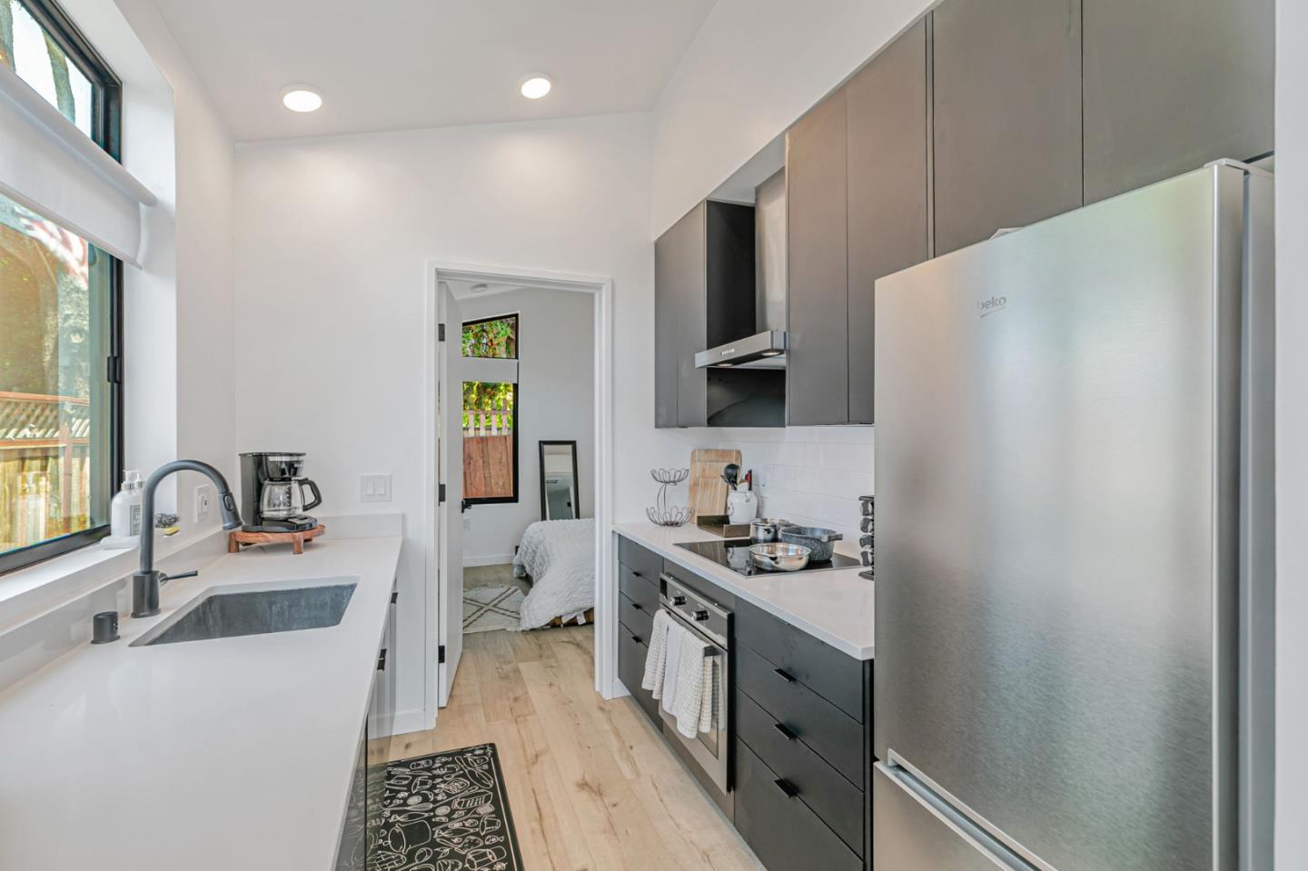 1555 Washington Street Santa Clara, CA 95050 - Photo 11 of 19 a kitchen with stainless steel appliances a sink stove and refrigerator