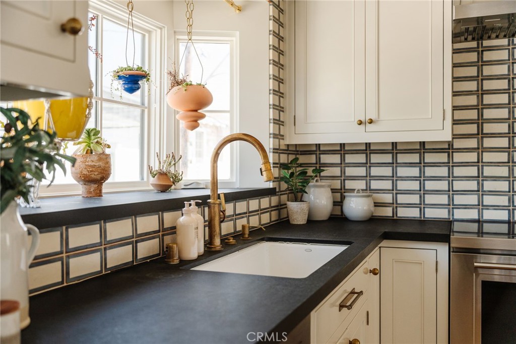 429 20th Street Manhattan Beach, CA 90266 - Photo 14 of 57 a kitchen with a sink and a stove
