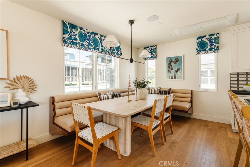 429 20th Street Manhattan Beach, CA 90266 - Photo 15 of 57 a view of a dining room with furniture window and wooden floor