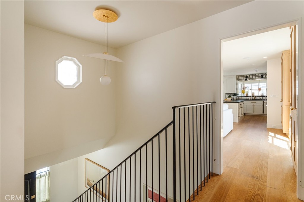429 20th Street Manhattan Beach, CA 90266 - Photo 17 of 57 a view of a hallway with wooden floor and a dining room