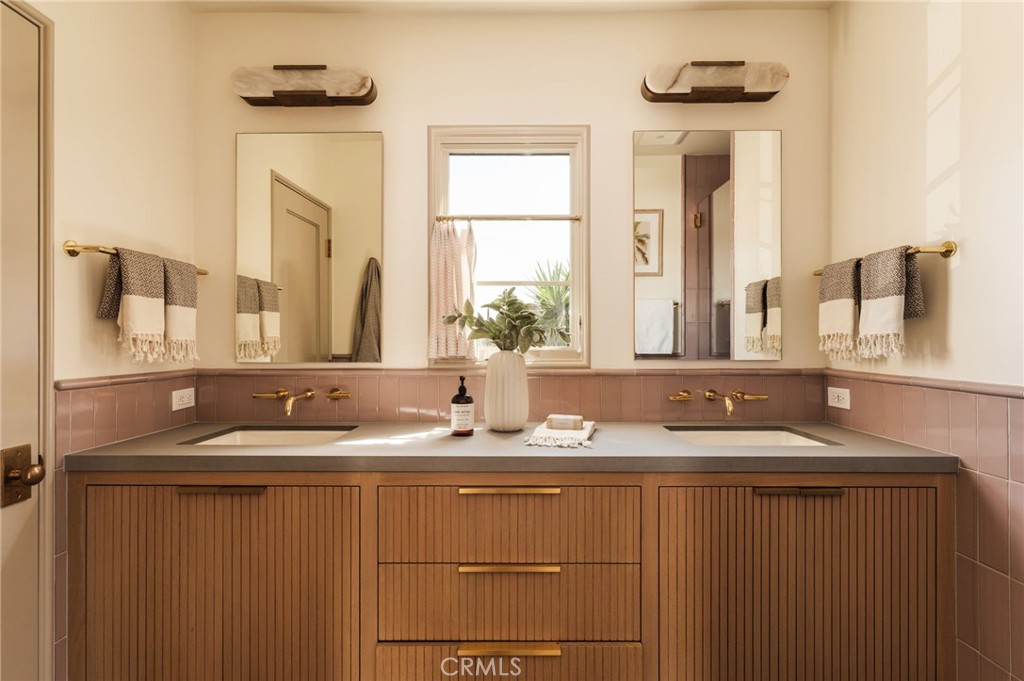 429 20th Street Manhattan Beach, CA 90266 - Photo 26 of 57 a bathroom with a sink and a mirror