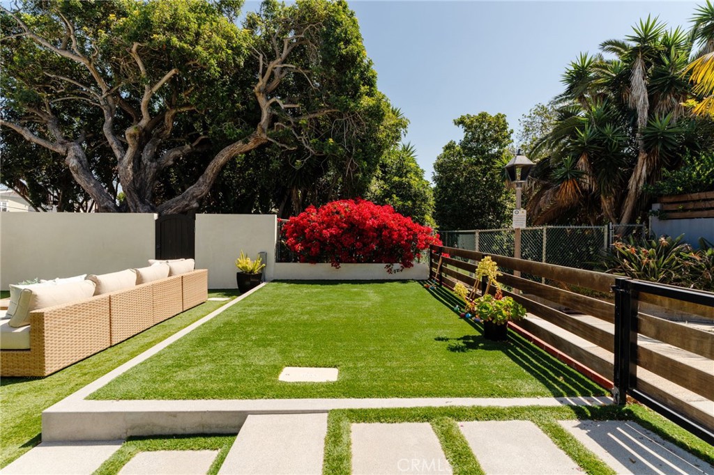 429 20th Street Manhattan Beach, CA 90266 - Photo 36 of 57 a view of a backyard with couches and a table