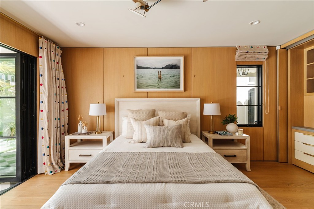 429 20th Street Manhattan Beach, CA 90266 - Photo 40 of 57 a bedroom with a bed and wooden floor