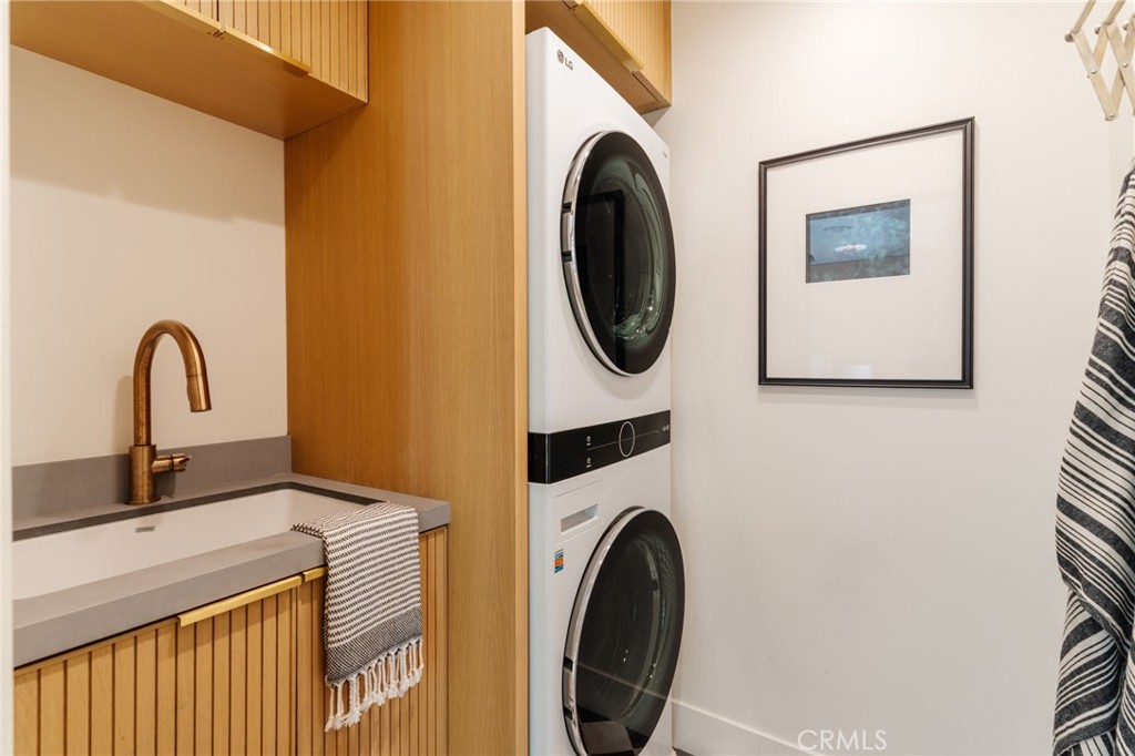 429 20th Street Manhattan Beach, CA 90266 - Photo 46 of 57 a utility room with dryer and washer