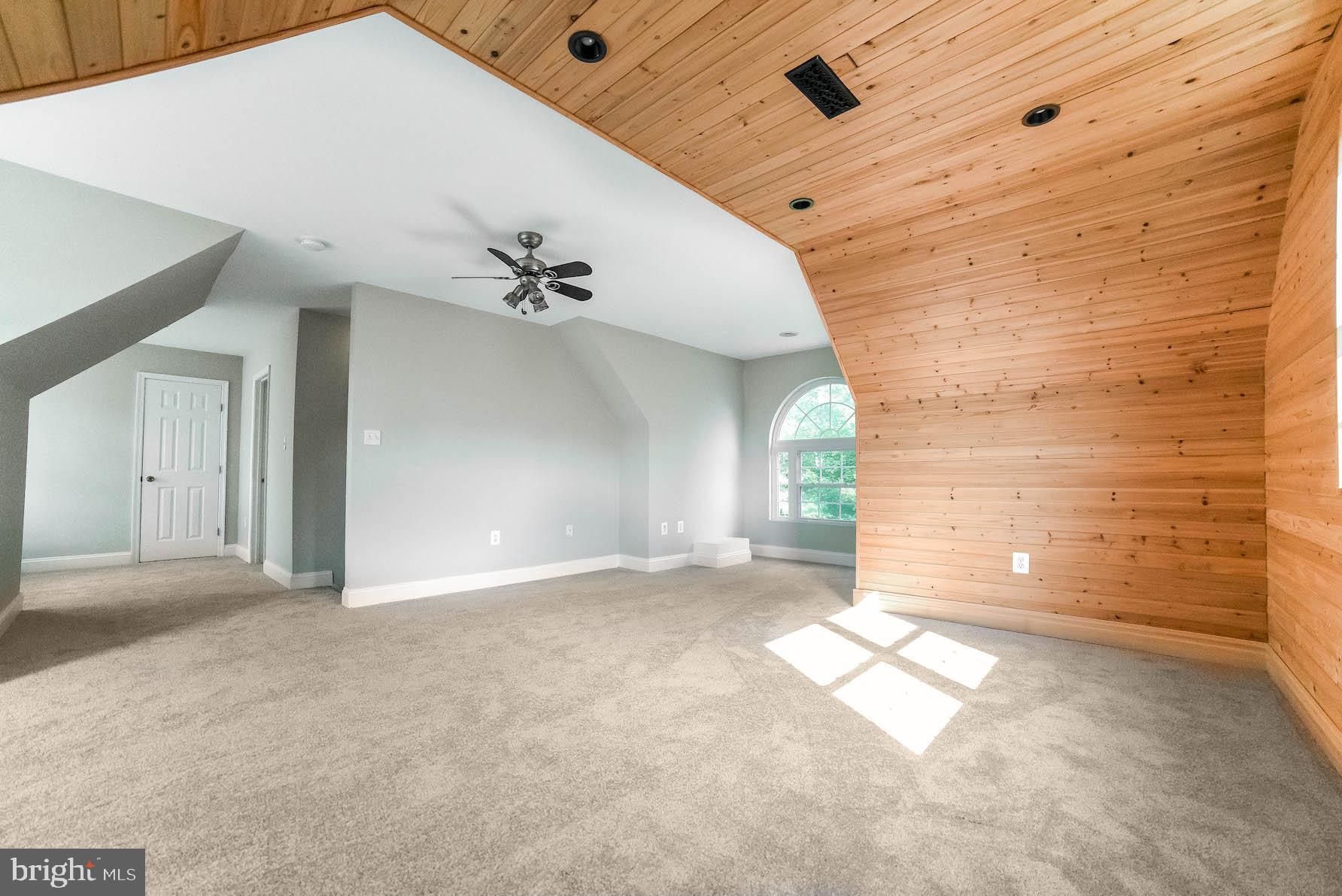 12756 Bullet Bend Road Lusby, MD 20657 - Photo 13 of 56 a view of a livingroom with a ceiling fan and window