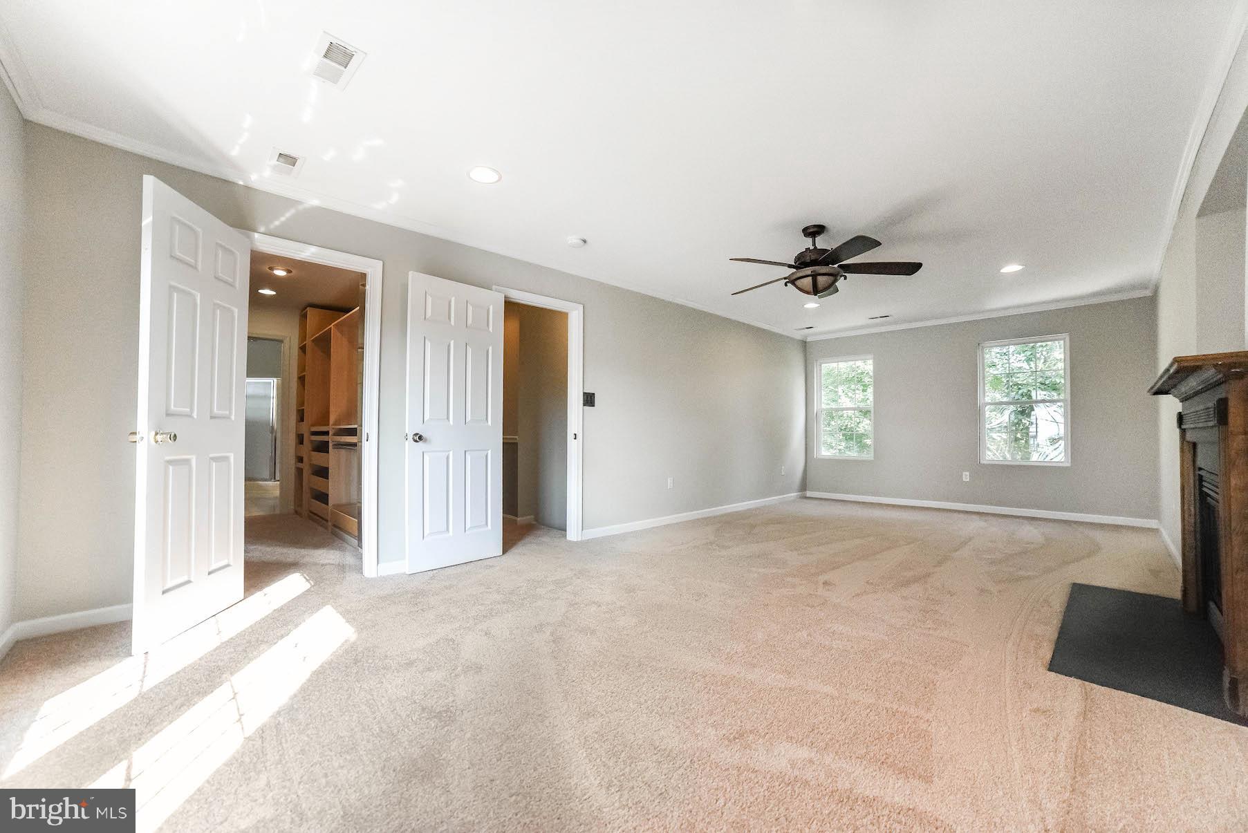 12756 Bullet Bend Road Lusby, MD 20657 - Photo 24 of 56 a view of a livingroom with a window and a ceiling fan