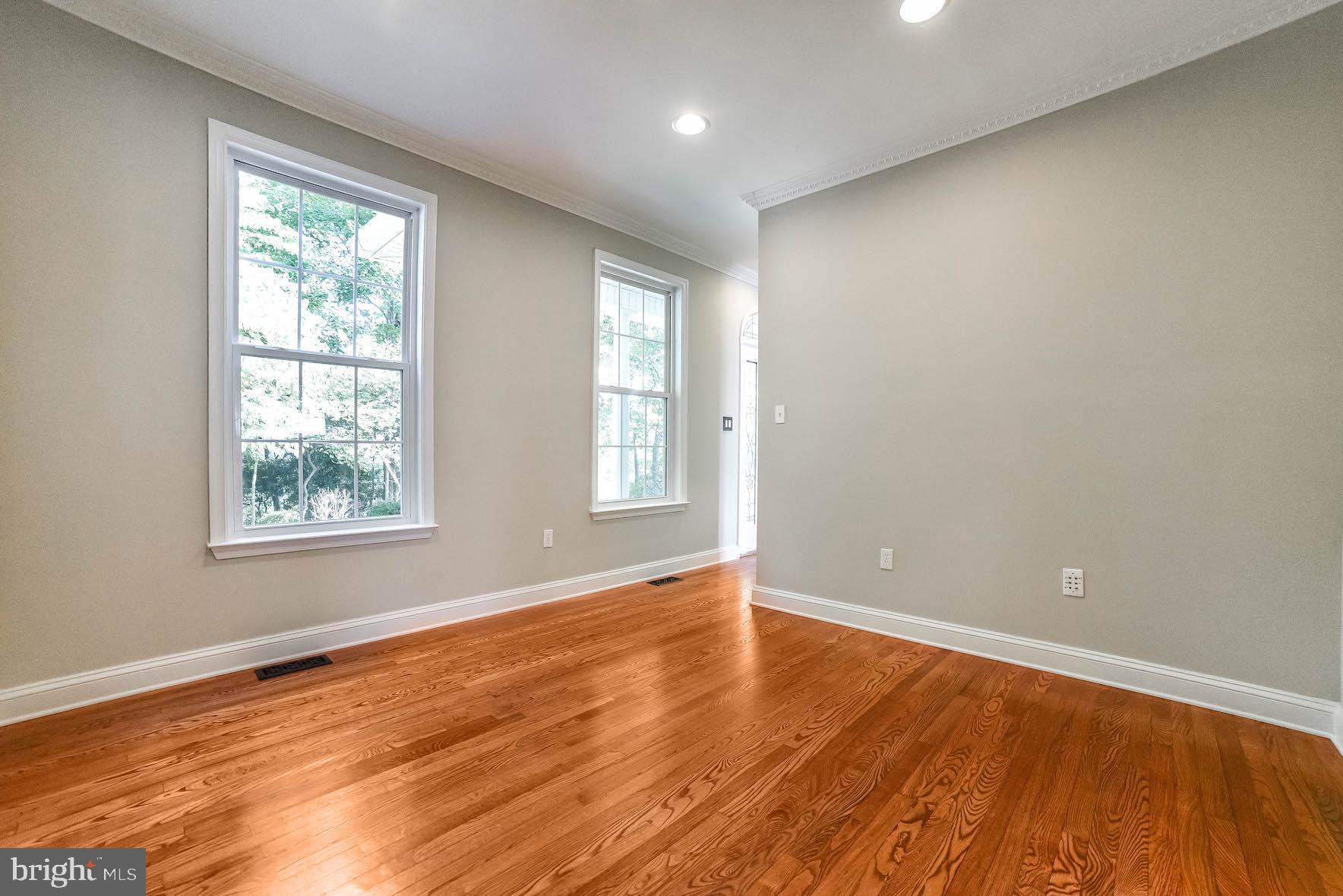 12756 Bullet Bend Road Lusby, MD 20657 - Photo 32 of 56 a view of an empty room with wooden floor and a window