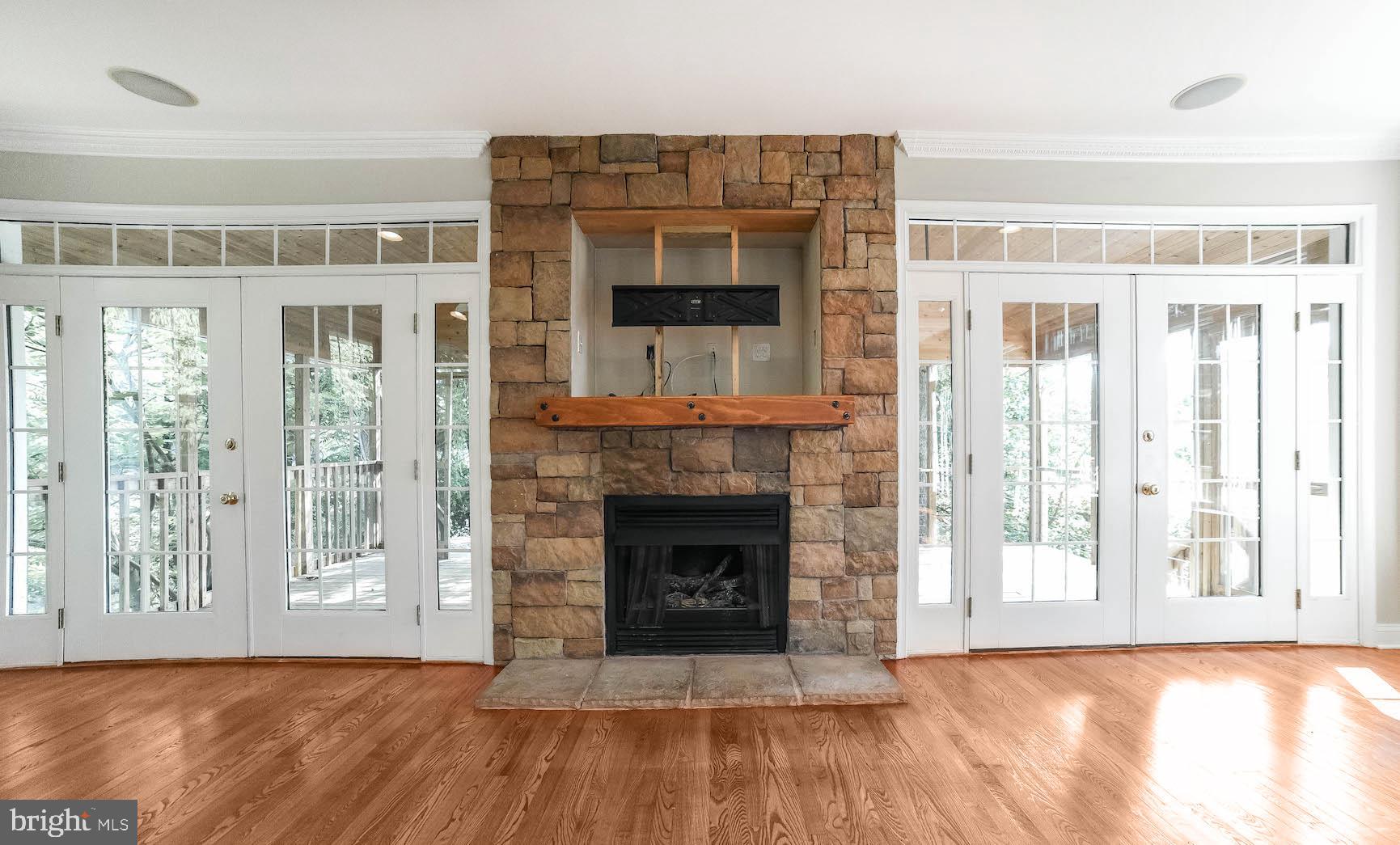 12756 Bullet Bend Road Lusby, MD 20657 - Photo 35 of 56 a view of livingroom with furniture wooden floor window and fire place