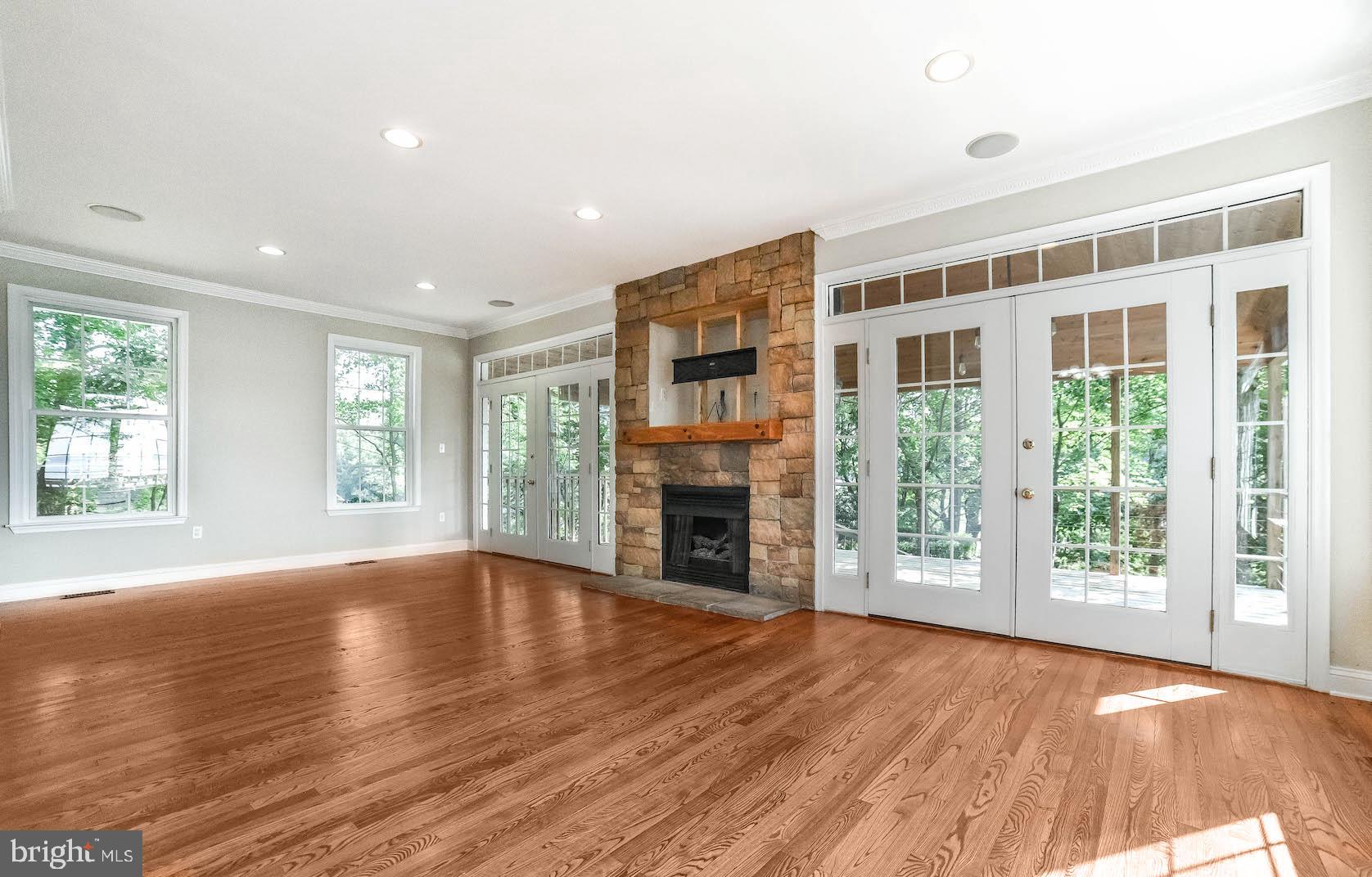 12756 Bullet Bend Road Lusby, MD 20657 - Photo 36 of 56 a view of an empty room with wooden floor and a window