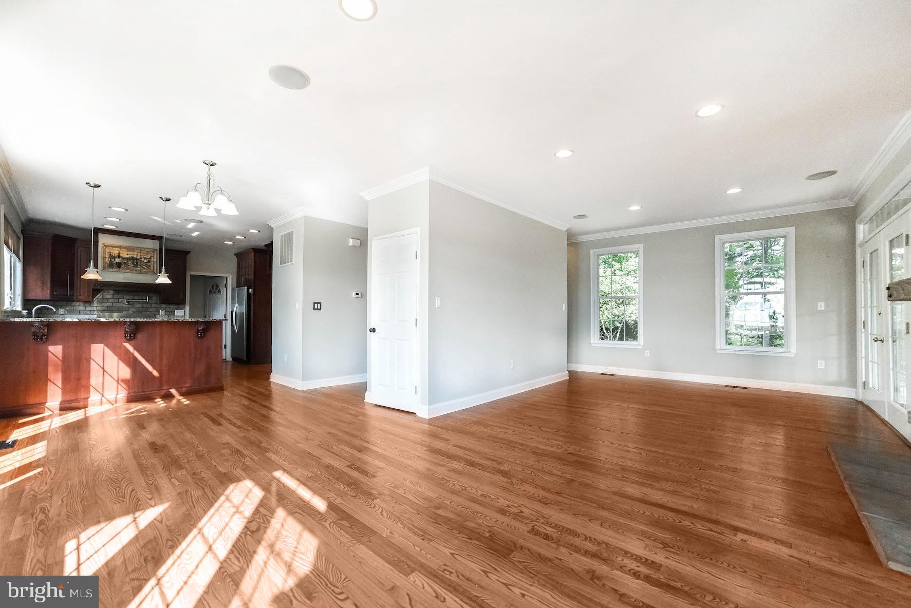 12756 Bullet Bend Road Lusby, MD 20657 - Photo 37 of 56 a view of livingroom and kitchen with wooden floor