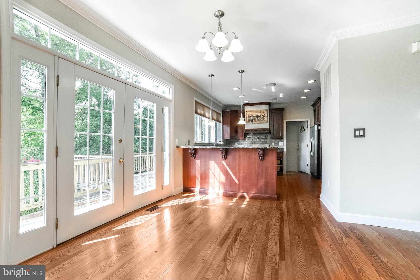 12756 Bullet Bend Road Lusby, MD 20657 - Photo 38 of 56 a view of a kitchen with furniture and wooden floor
