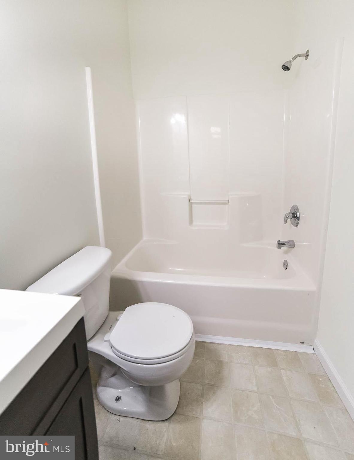 12756 Bullet Bend Road Lusby, MD 20657 - Photo 46 of 56 a bathroom with a toilet a sink and bathtub