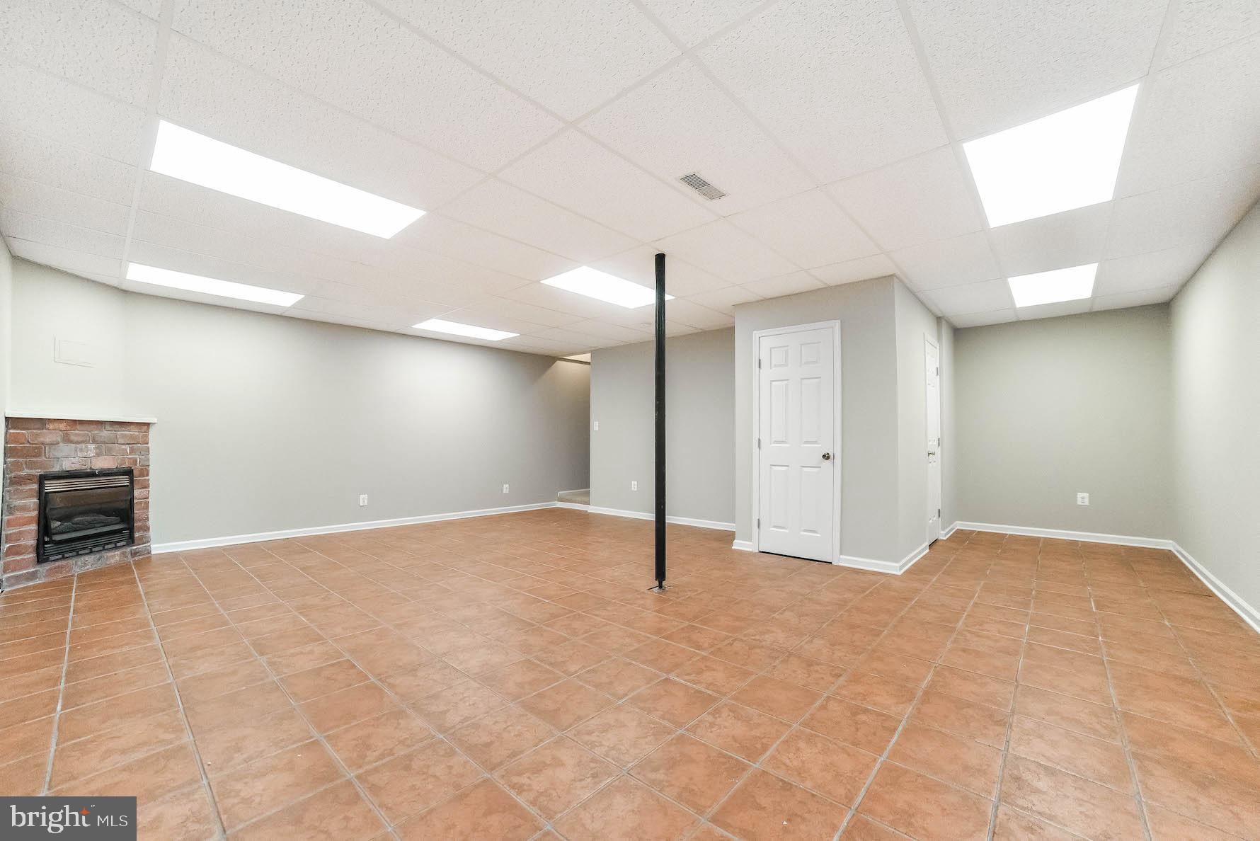12756 Bullet Bend Road Lusby, MD 20657 - Photo 50 of 56 a view of an empty room with a fireplace