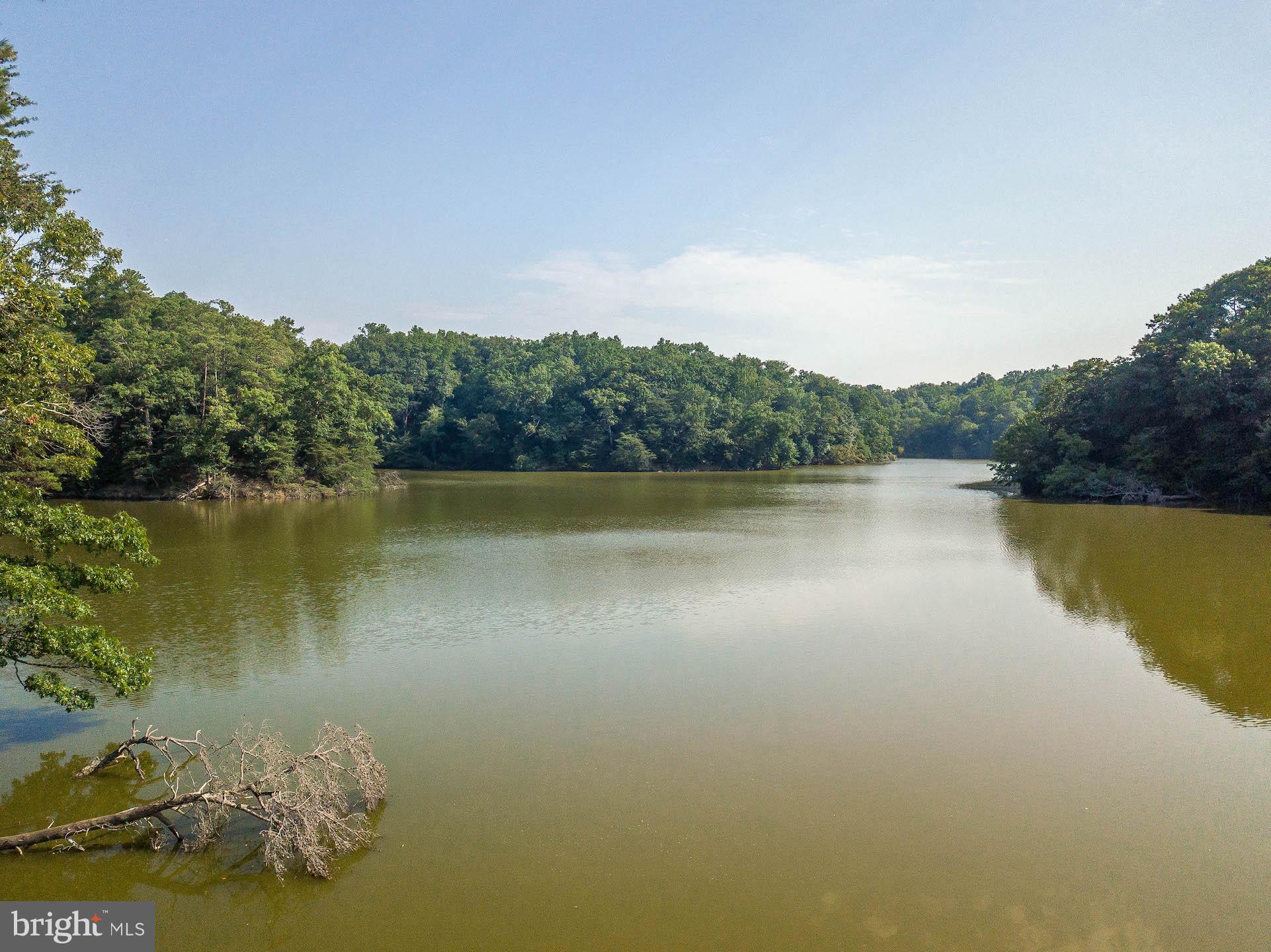 12756 Bullet Bend Road Lusby, MD 20657 - Photo 6 of 56 a view of a lake with a city